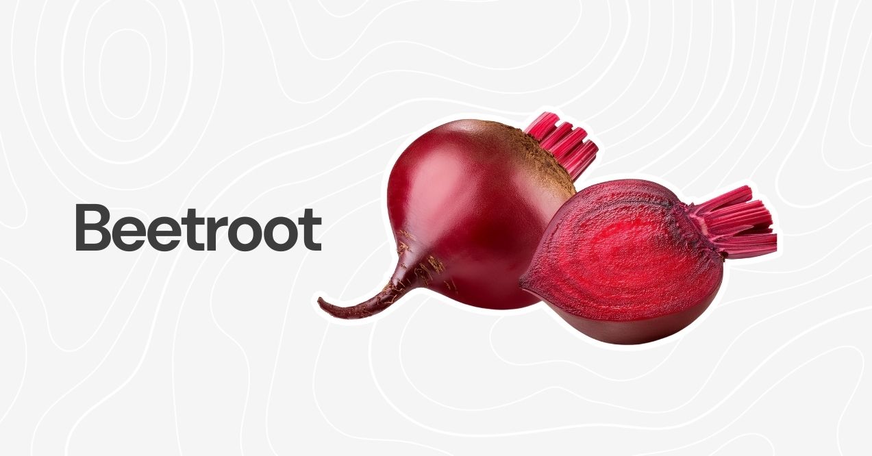 A whole and sliced beetroot with vibrant red color against a neutral background.