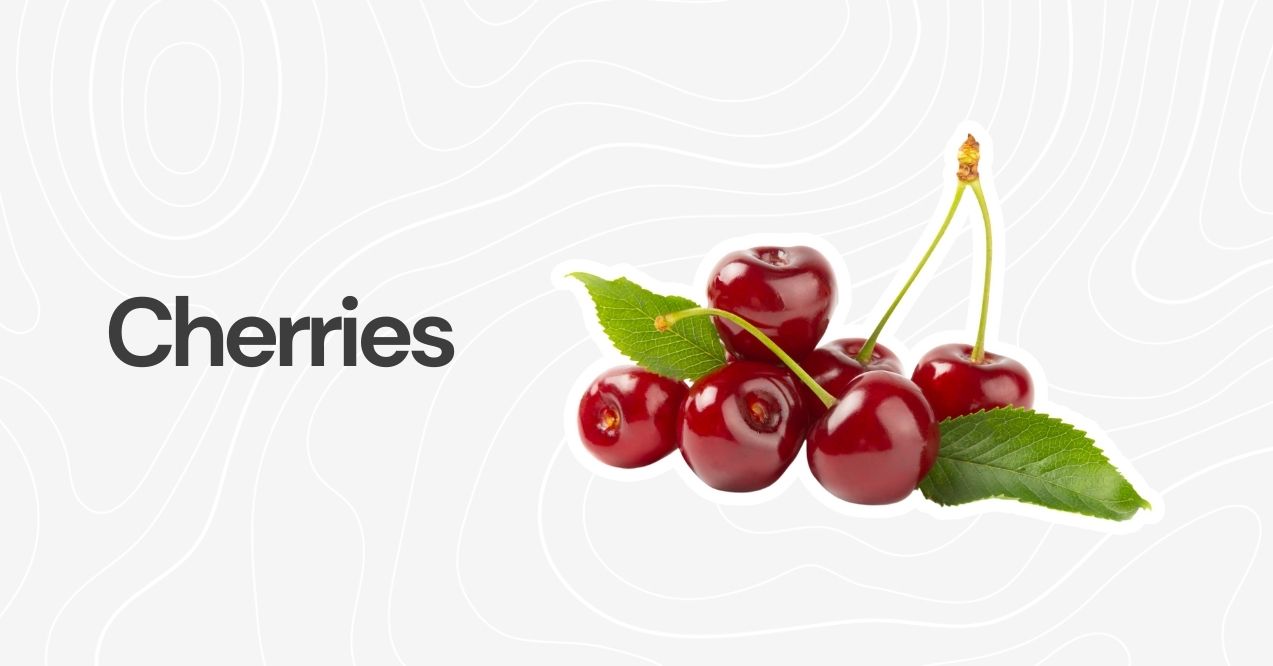 Fresh red cherries with green stems and leaves on a neutral background.