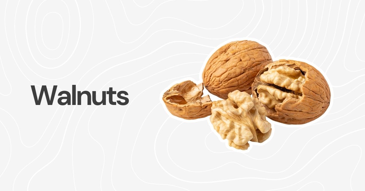 Whole and shelled walnuts on a neutral background.