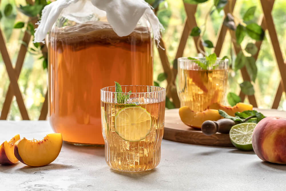 a glass of tea with lemon inside