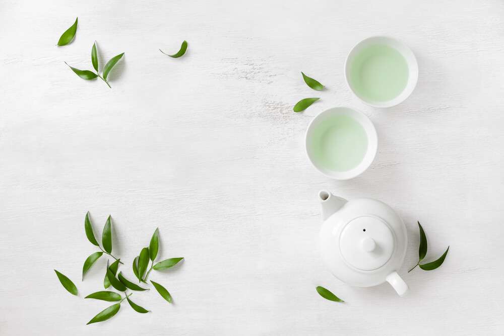 a few white cups of green tea