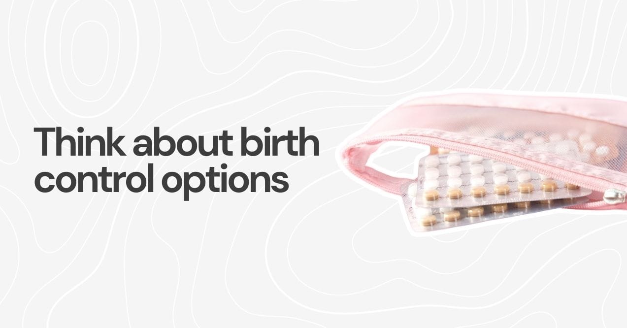 Close-up of birth control pills in a pink pouch.