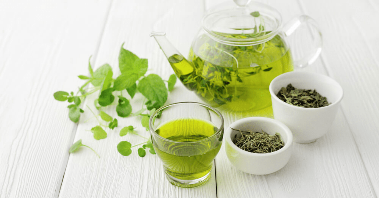 Healthy Green Tea Cup with Tea Leaves
