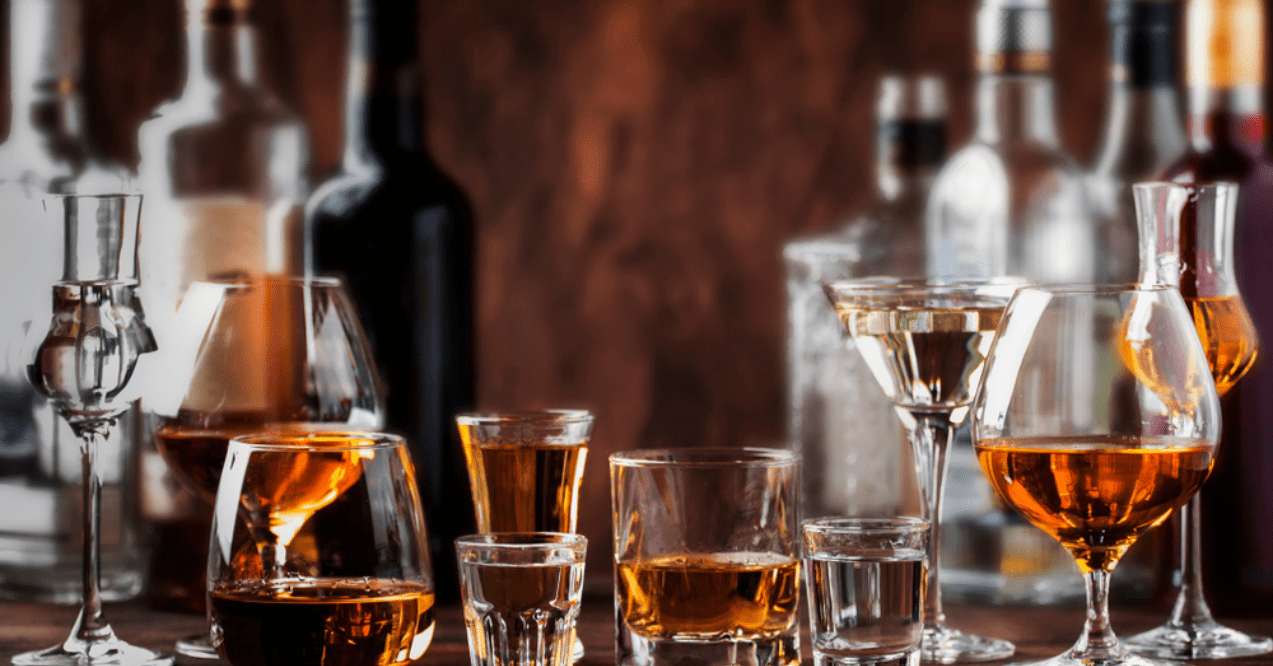 Strong Spirits Set. Hard alcoholic drinks in glasses in assortment: vodka, cognac, tequila, brandy and whiskey, grappa, liqueur, vermouth, tincture, rum.
