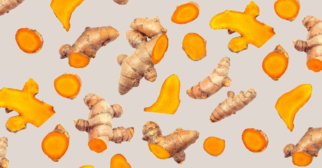 Turmeric pieces in the brown background
