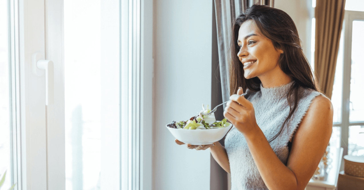 Woman Eating a Healthy Bowl