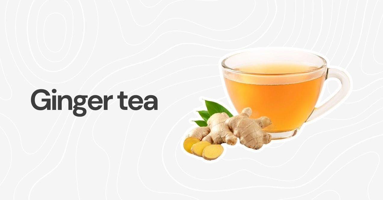 A cup of ginger tea with fresh ginger root and leaves as garnish.