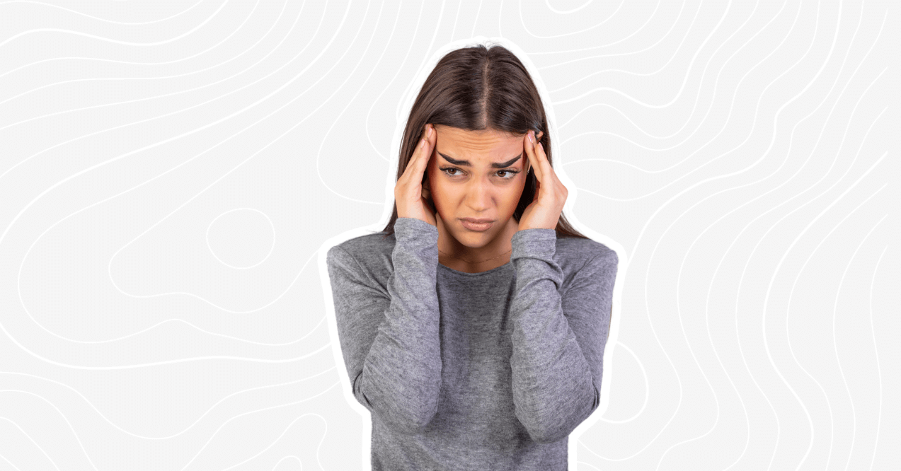 woman holding her head because of a headache