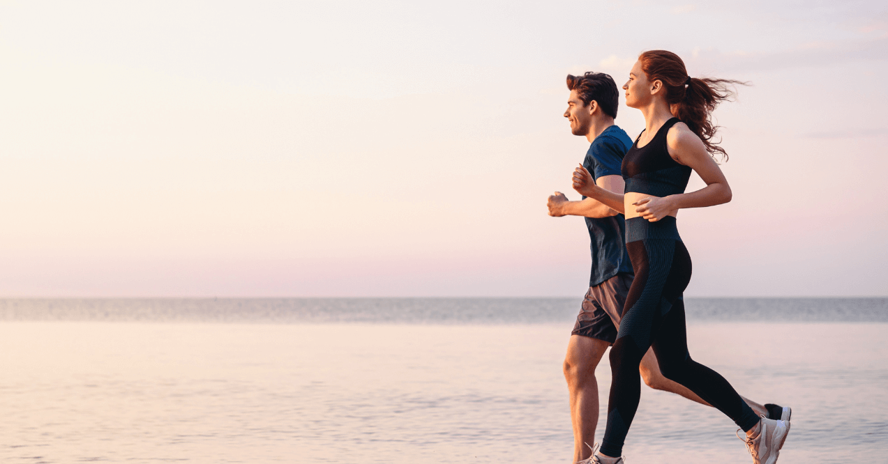 Athletic couple Jogging by the seaside