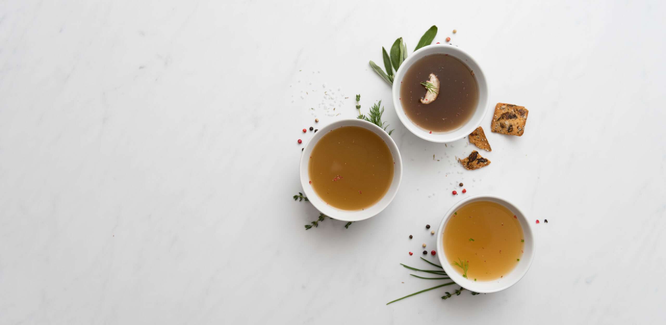 Assortment of Bone Broth in Small Bowls
