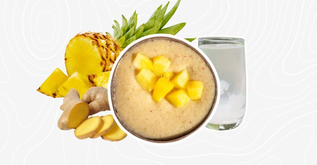 Pineapple ginger coconut water smoothie with chunks of fresh pineapple and ginger.