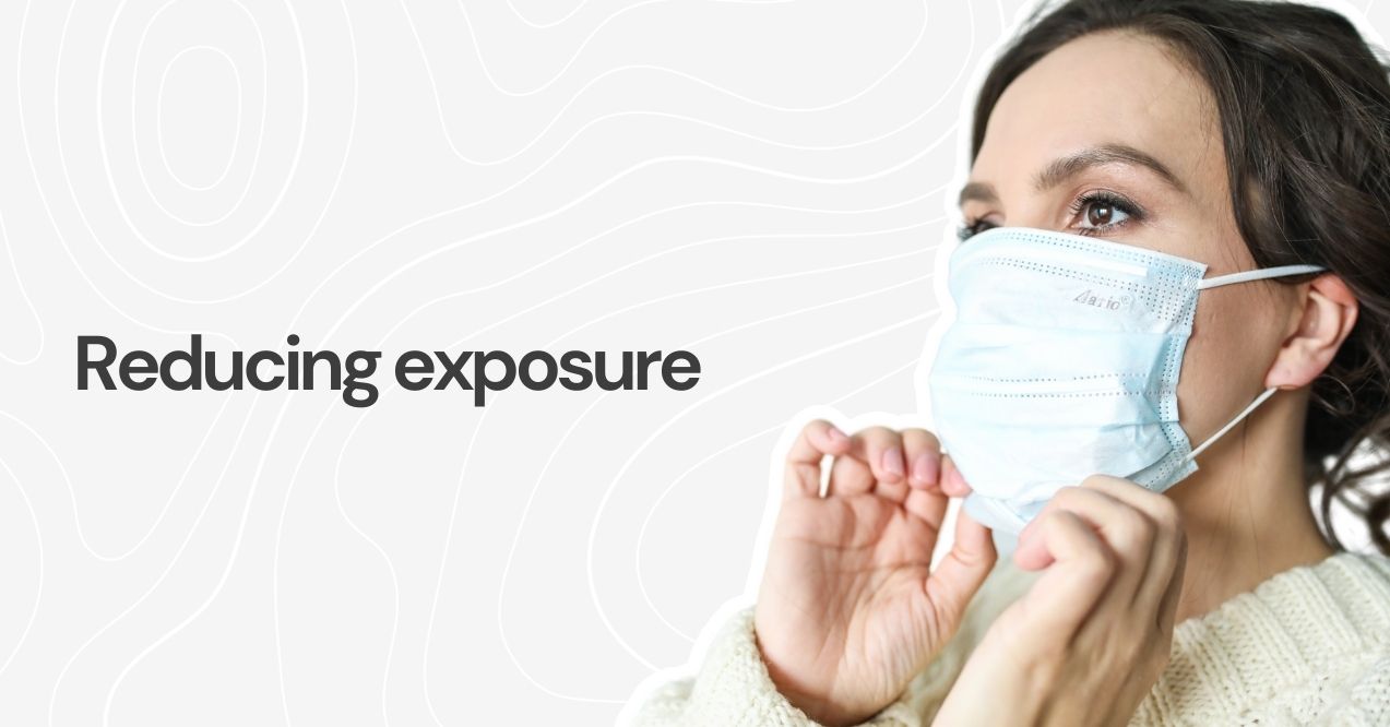 Woman wearing a mask to reduce allergen exposure.