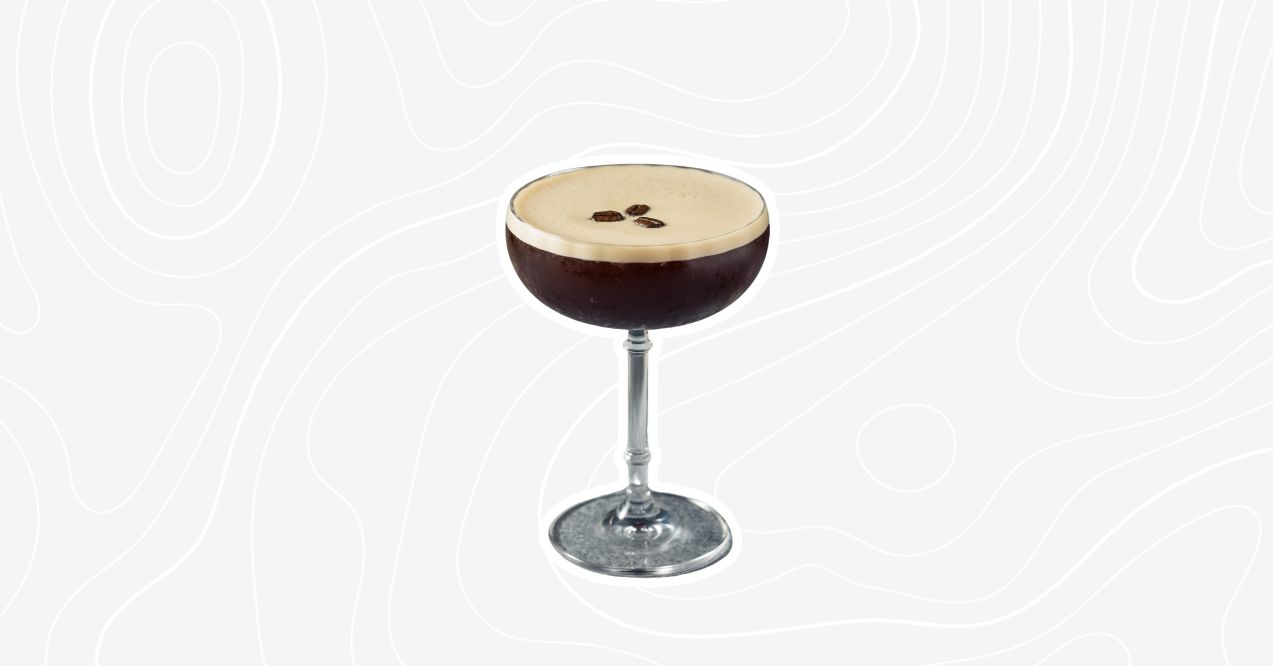 A non-alcoholic espresso martini in a tall glass, garnished with three coffee beans.