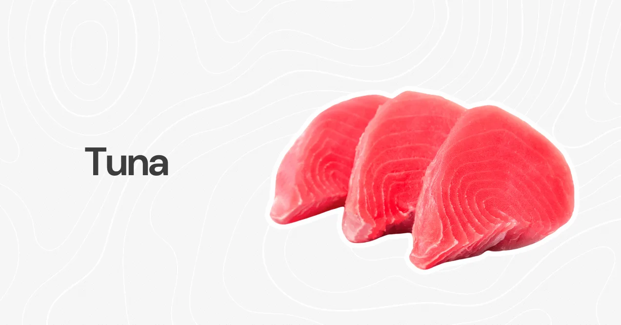 Three raw tuna steaks with a deep red color, displayed on a white background with a subtle pattern.