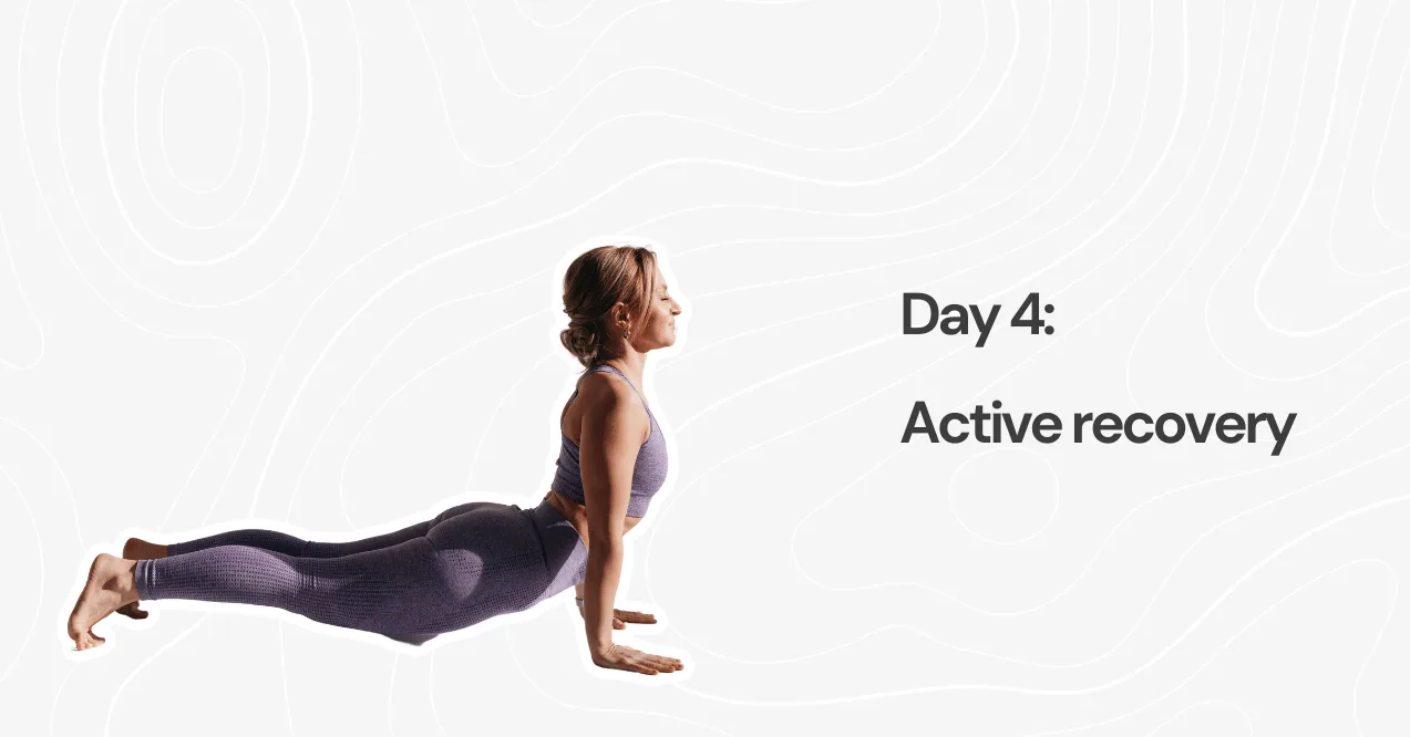 Woman performing upward dog yoga pose for active recovery - 5 day hybrid training program