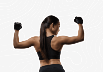 Strong, athletic woman in a black sports outfit flexing her toned arms and back, wearing workout gloves. The background features a subtle abstract pattern.
