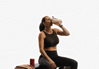 woman drinking a shake after exercise